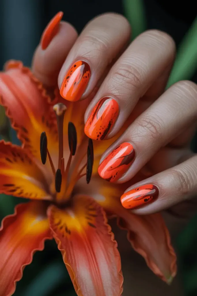 tiger lily inspired nail art, bold orange and coral nails with dark speckled details, petal-like brush strokes, dramatic contrast, deep shadowy background, warm cinematic lighting, artistic botanical style, high fashion editorial nail photography, macro detail, pinterest vertical 2:3 ratio, no text