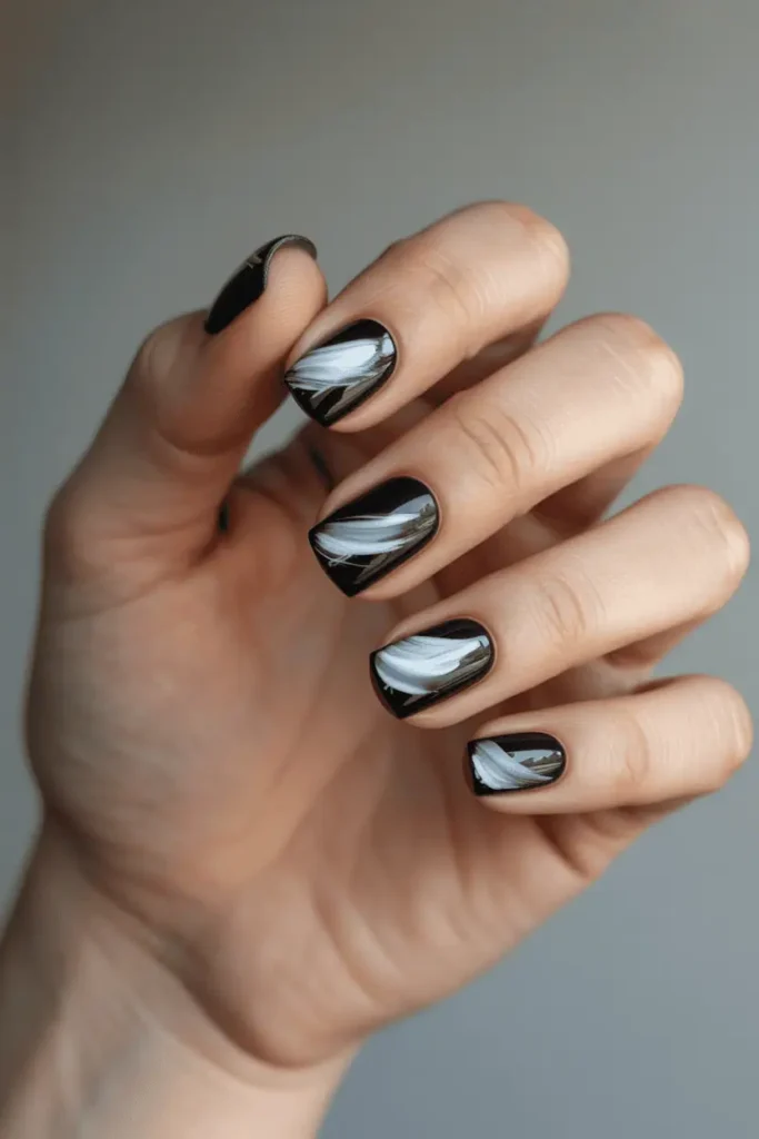 black nails with white and gray expressive brushstroke art, artistic edgy style, high-contrast design, soft minimal background, realistic hands