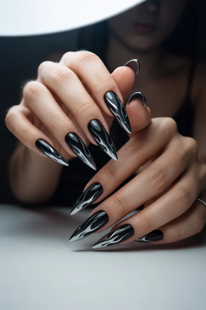 black nails with metallic silver chrome flame designs, futuristic edgy aesthetic, clean modern background, dramatic lighting, realistic hands