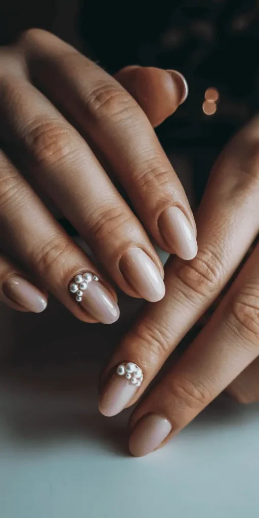 Almond-shaped nails in solid dusty rose with matte finish, elegant single-color Valentine's manicure