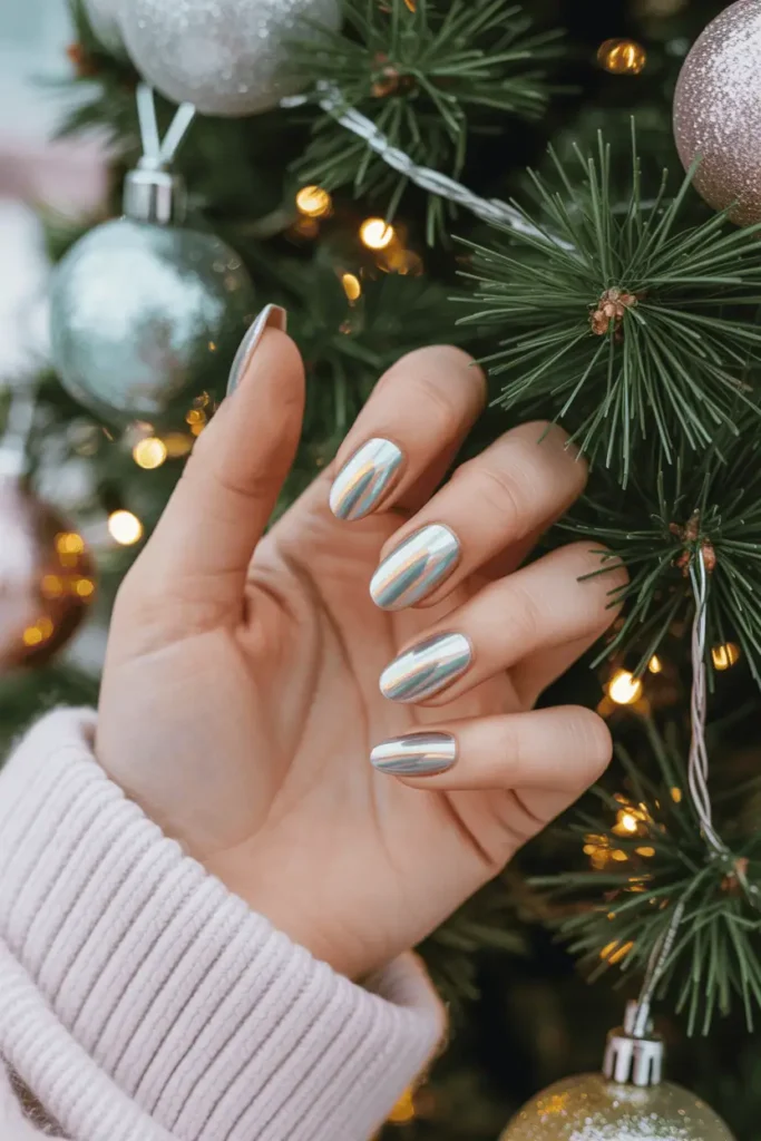 Holographic chrome nails reflecting Christmas lights, teen hands near a decorated tree.