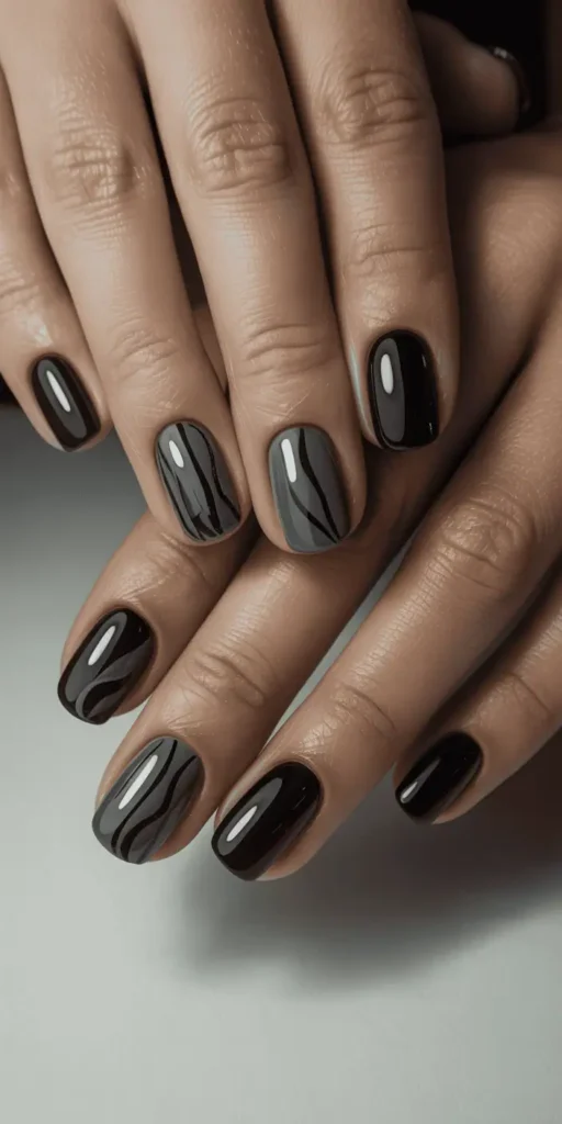 Create contrast with all-black nails โ but alternate matte and glossy finishes for texture and shine without needing color.